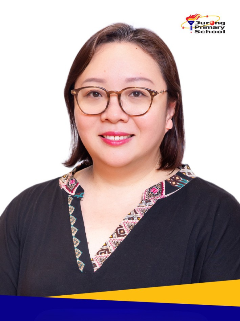 Smiling woman in black top with patterned neckline, round glasses